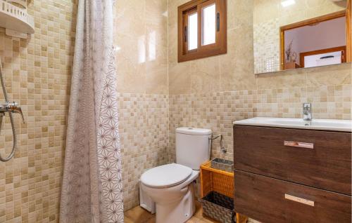 a bathroom with a toilet and a sink and a shower at Amazing Home In Sedella With House A Panoramic View in Sedella