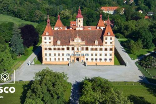 an aerial view of a large castle with trees at Quiet Room with shared kitchen bathroom in Graz