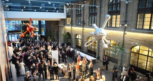 a crowd of people in a building with balloons at Clarion Hotel Post in Gothenburg