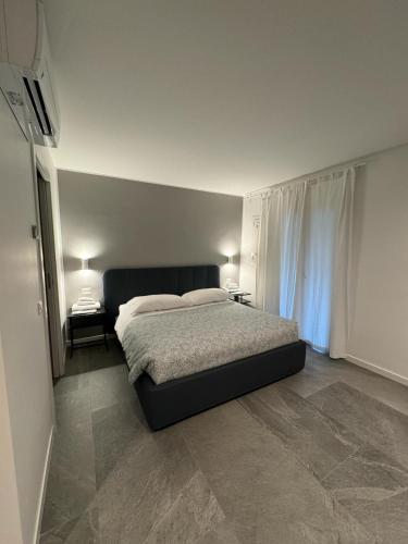 Ένα ή περισσότερα κρεβάτια σε δωμάτιο στο Alla Casa Di Gio