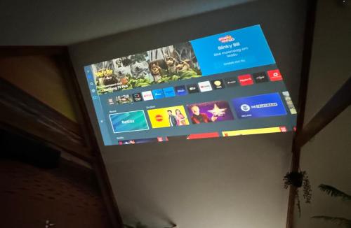 a flat screen tv hanging on a wall at Bed & Wellness Chinel Luxe vakantiehuis met Sauna's en Bubbelbad in Sint Annaland