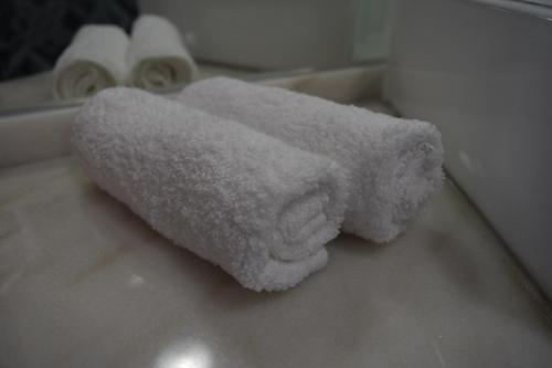 a white towel sitting on top of a bathroom sink at Acolhedor Apartamento Em Alfama in Lisbon