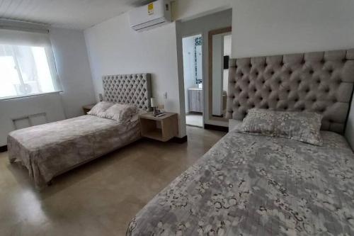 Ένα ή περισσότερα κρεβάτια σε δωμάτιο στο Penthouse en Cartagena
