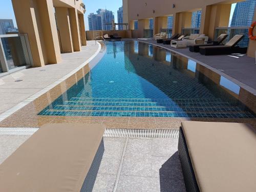 a swimming pool in the middle of a building at Seaview & Marina View Studio in Dubai