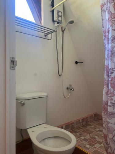 a bathroom with a toilet and a shower at Fun Da House in San Juan