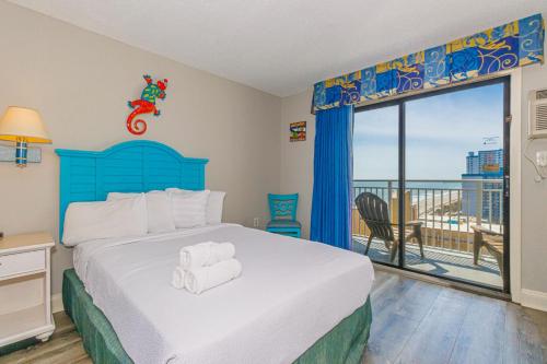 Giường trong phòng chung tại Sea Mist 51405