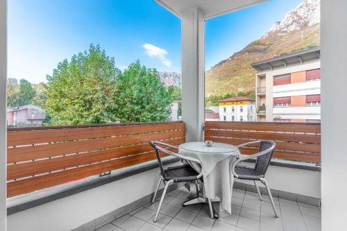 a balcony with a table and two chairs at Albergo Sorriso in Boario Terme