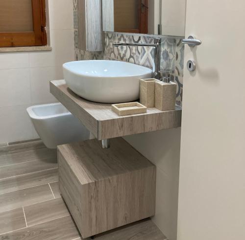 a bathroom with a tub and a sink on a counter at InternoUno in Diamante