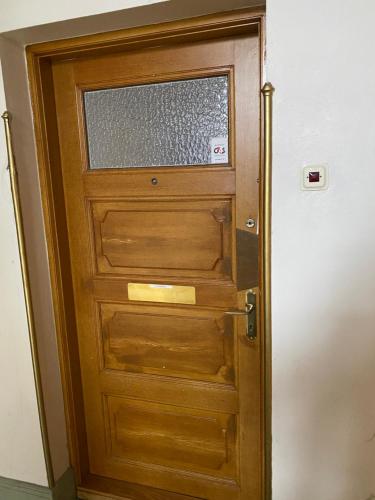 a wooden door with a window in a room at Comfort appartment in Värnhem, Malmö in Malmö