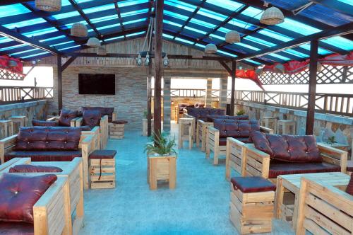 a room with couches and chairs in a building at OCEAN6 in Accra