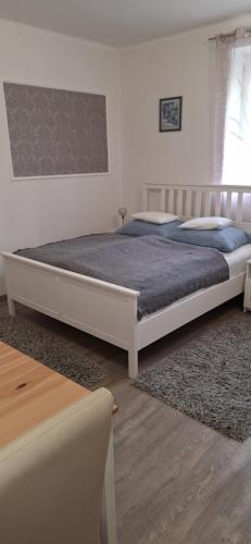a bedroom with a large bed in a room at Amira apartman in Eger