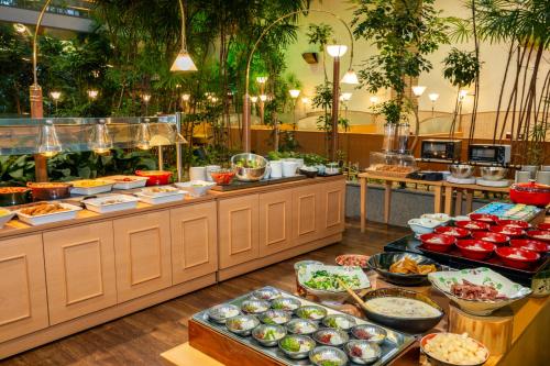 a buffet line with many different types of food at KAMENOI HOTEL Fukui in Fukui