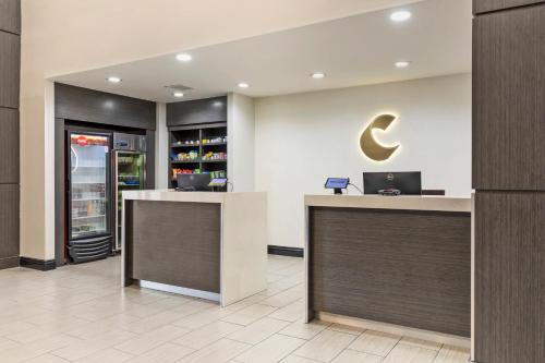 a lobby with a crescent moon on the wall at Comfort Inn & Suites Irving Las Colinas DFW in Irving