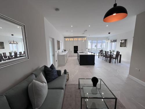a living room with a couch and a table at Modern Dunboyne Home in Dunboyne