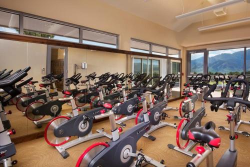 a gym with a lot of exercise bikes in a room at Garden of the Gods Resort & Club in Colorado Springs