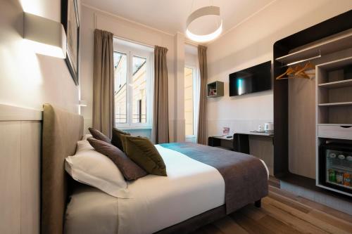 Llit o llits en una habitació de Hotel de' Clementi