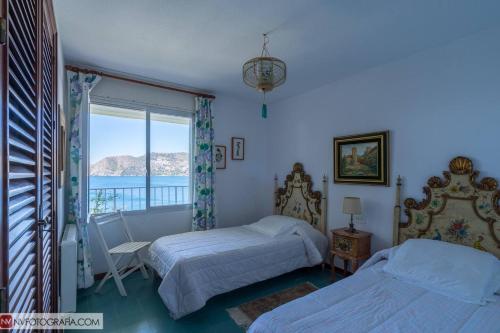 En eller flere senge i et værelse på Sunny Villa with Private Pool in Almuñécar