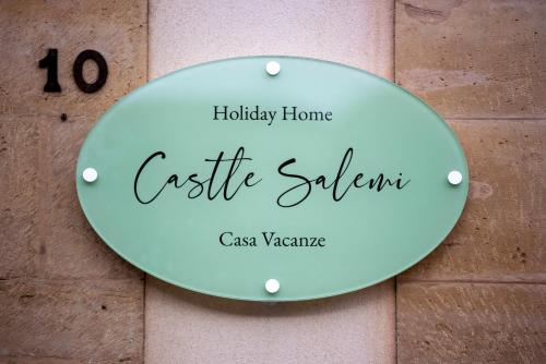 a sign on a wall with the words castle salon at Holiday Home Castle Salemi - Casa Vacanze in Salemi