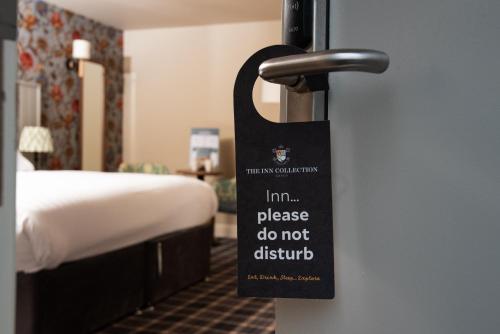 a sign on the door of a hotel room at The Stables - The Inn Collection Group in Whitby