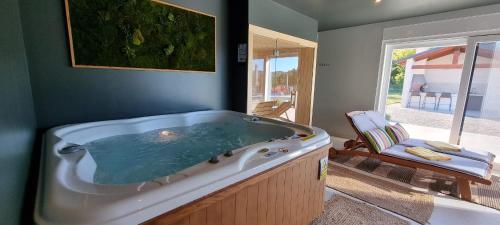 a large bath tub in a room with at Green Forest in Buzet