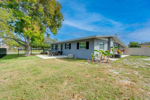 a small blue house with a yard at Bright Venice Getaway Less Than 1 Mi to Historic Dtwn in Venice
