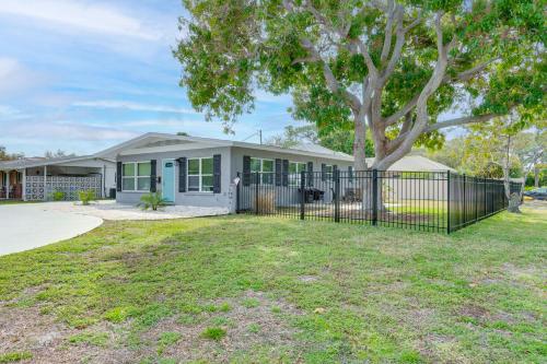 a house with a fence and a tree at Bright Venice Getaway Less Than 1 Mi to Historic Dtwn in Venice