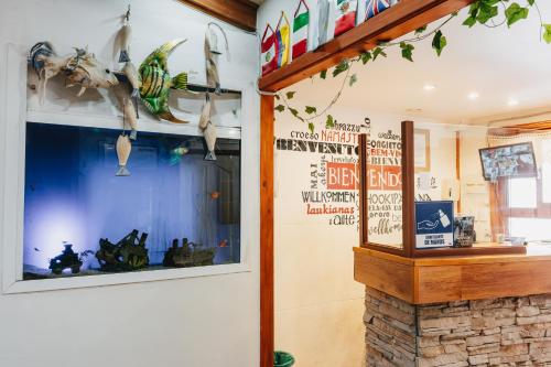 a shop with a fish tank in a window at Hostal Concepcion in Concepción