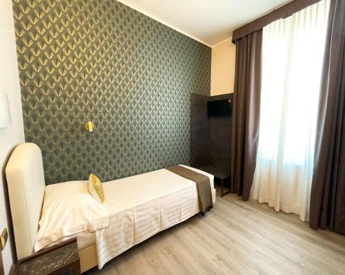 Katil atau katil-katil dalam bilik di Hotel Florence Milano