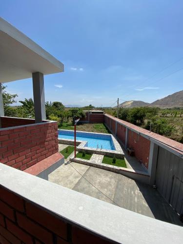a swimming pool on the roof of a house at Casa Polska in Paiján