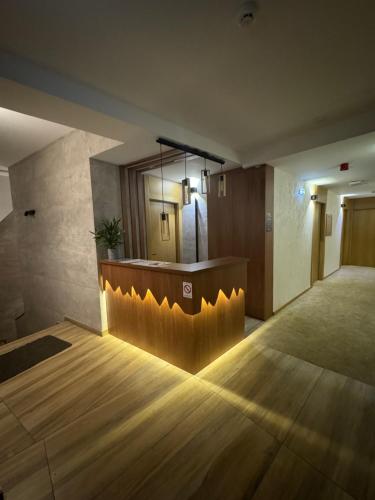 a lobby with a reception desk in a building at Apartments Suncani Vrhovi Kopaonik in Kopaonik