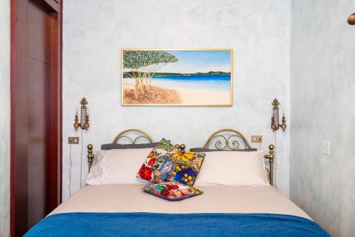 a bedroom with a bed and a picture of a beach at Dream Suite in Milan