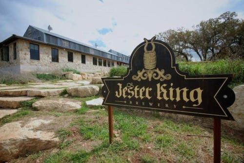 a sign in front of a building with a museum listing at Cozy Cabin w Pvt Heated Pool Under Epic TX Stars in Dripping Springs