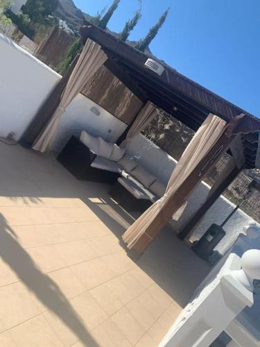 a pile of wood sitting on top of a roof at Villa Casa Queen in Mojácar