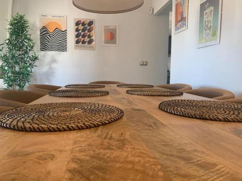 a large wooden table with brown chairs around it at Villa Casa Queen in Mojácar