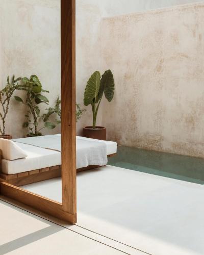 a mirror in a room with two beds at Lunaya in Puerto Escondido