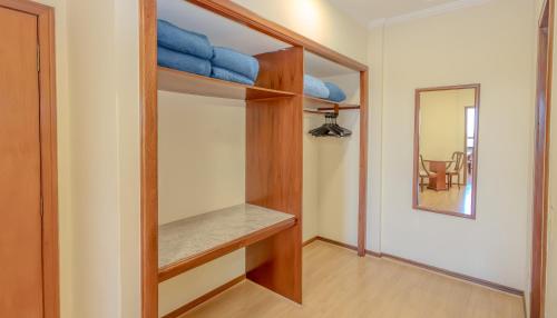 a room with bunk beds and a mirror at Lizon Curitiba Hotel in Curitiba