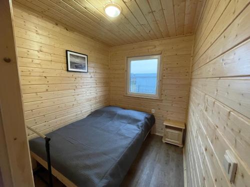 Säng eller sängar i ett rum på Domki letniskowe Gąski