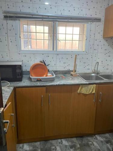 a kitchen with a sink and a counter top at 2 Bedroom and a kitchen. in Abuja