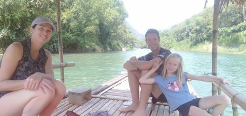 a group of people sitting on a boat on the water at Pù Luông JUNGLE KING 1 HOMESTAY in Pu Luong