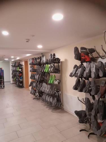 a room with a bunch of shoes on the wall at Mühlbacherhof in Rennweg