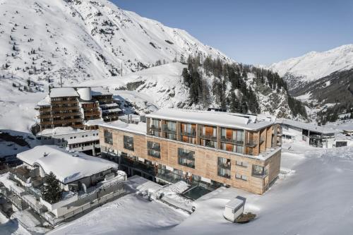an aerial view of a building in the snow at The Crystal VAYA Unique in Obergurgl
