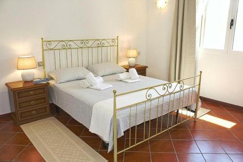 Un pat sau paturi într-o cameră la Casa al Mare in Sardegna Pittulongu