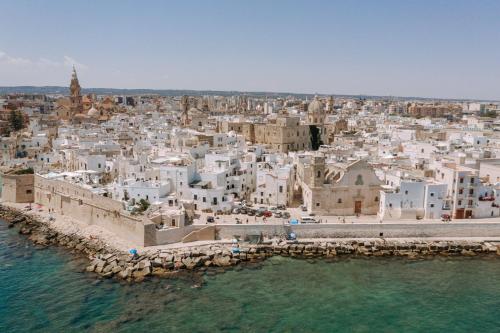 an aerial view of a city from the water at Le Contrade Di San Salvatore in Monopoli