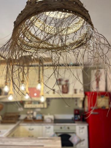 a net hanging from the ceiling of a kitchen at 1957 To Rodo kai to Roido in Karpenision