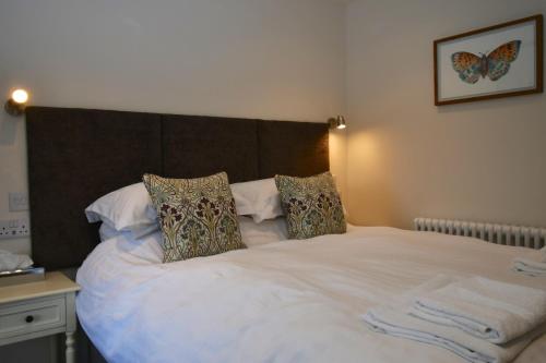 Ένα ή περισσότερα κρεβάτια σε δωμάτιο στο Carew Inn
