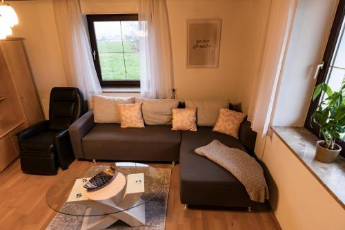 a living room with a couch and a table at Ferienhaus Moser in Lengau