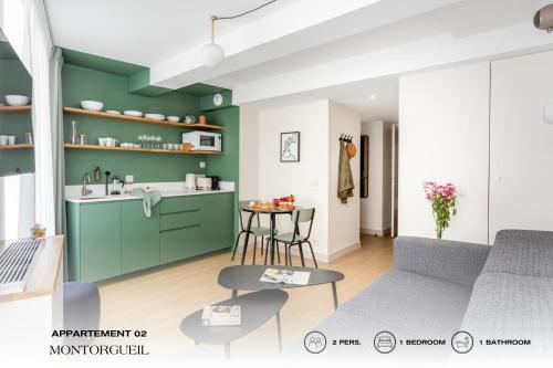 a rendering of a living room and kitchen with green walls at Beauquartier - Montorgueil in Paris
