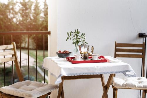 a table with a plate of food on it at ZEM casolare in Petriolo