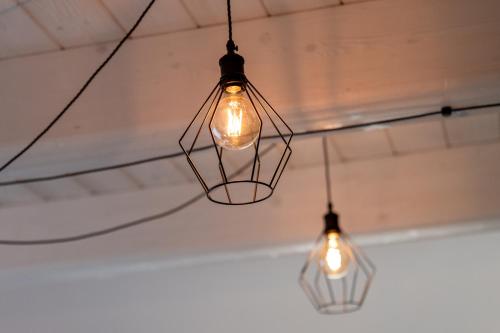 a couple of lights hanging from a ceiling at Casa Addis B&B in Scapezzano