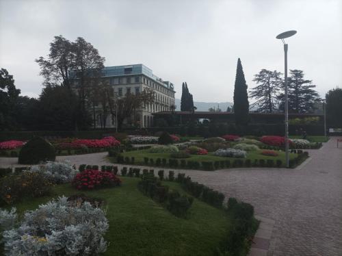 a garden with flowers in front of a building at Стан in Prilep